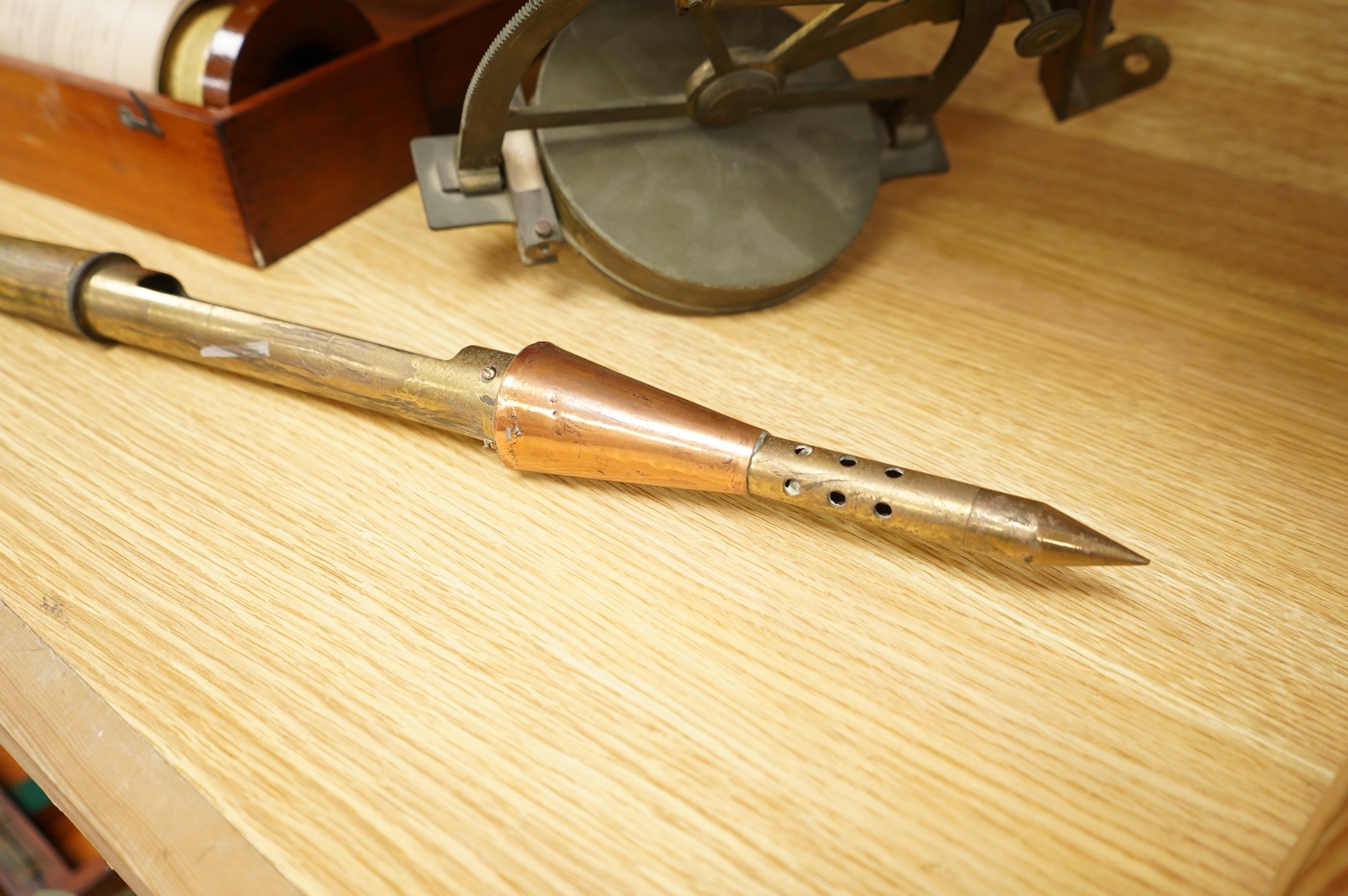 A brass and glass thermometer, with an ash handle, together with an early 19th century brass mining theodolite, by William Wilton, St. Day, Cornwall, (2)
